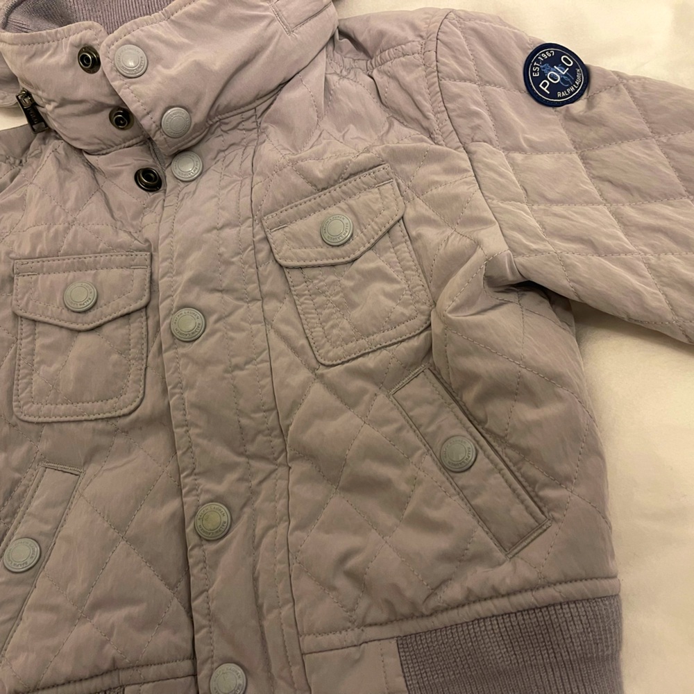 Ralph Lauren Light Weight stylish jacket with pocket for hood in collar.